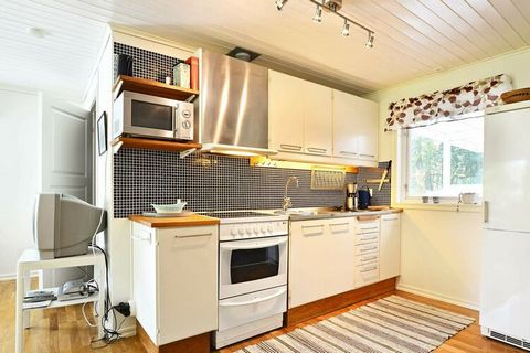 This cosy holiday home is set amongst woodlands only 100 metres from the pretty lake of Kjälken, outside of Belganet in Blekinge. The house is set upon an elevated natural plot and includes a covered terrace with a stunning view of the scenic surroun...