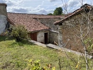 This stone property consisting of two houses for complete renovation is located in a small village within ten minutes of an active town - shops and a bar! The historic town of Confolens is a thirty minute drive from the house - ideal for work and ple...