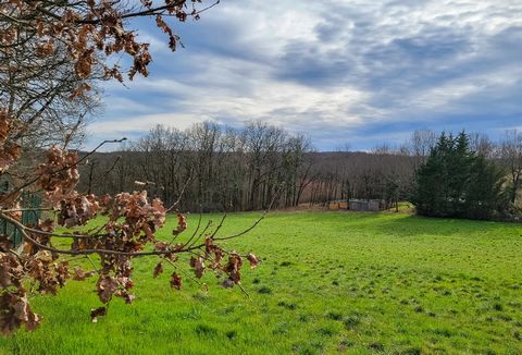 A large plot of land with far reaching views over the surrounding countryside. The total area is 1.14 ha of which 5067 m2 is constructible. Part of the plot is wooded with a small stone barn. The plot is in an exceptional position with water and elec...