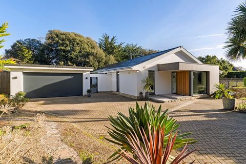 This fabulous home offers modern lateral living in a secluded level plot close to the beach. Cleverly reimagined by the current owners and their architect, the house has been specified with the finest materials and finishes and with an exquisite atte...