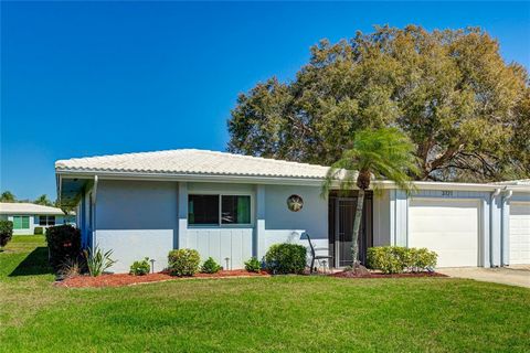 Experience living in the vibrant 55+ community of Village Green. This 2-bedroom, 2-bathroom condo/villa, spanning 1,651 sq ft, boasts a sunlit Florida room and a versatile den. The kitchen, complete with a new stainless steel refrigerator and pantry,...