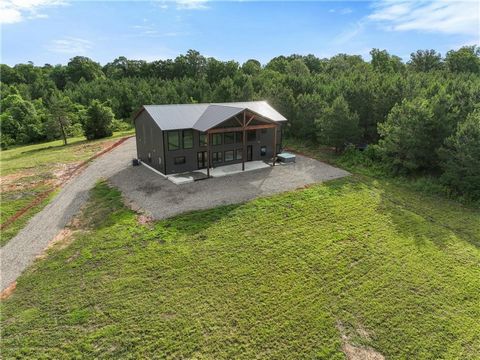 Fantastic Opportunity to own this Beautiful 4 bedroom 3 bath home located on over 14 acres. Rather you want to own your dream home or invest in a property with plenty of room to build multiple STR cabins this is your chance. Currently a primary resid...