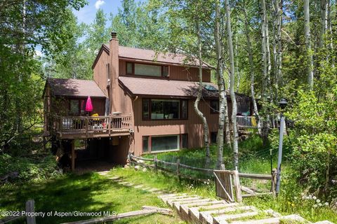 This five-bedroom, five full bathroom home is tucked in with mature Aspen trees as if it were always meant to be there. Updated with new carpet, paint, bathrooms, and various appliances throughout, this 3,000 square-foot home offers the feel of a lat...