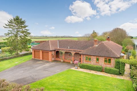 Located in a charming village in the rolling Cambridgeshire countryside with excellent transport links within easy reach, this property offers the best of both country and town living. Set in a plot of over an acre, this individual single-storey home...