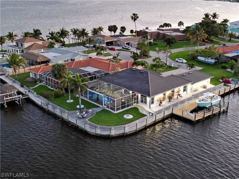 This luxury custom built riverfront pool home is located on the tip of Harney Point and has been updated from top to bottom. This home is situated on an oversized lot with almost 300 feet of illuminated seawall walkway with a nautical theme with stun...