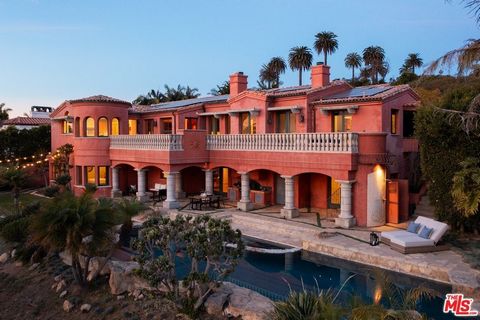 Perched in the exclusive Lunada Pointe community of Rancho Palos Verdes, this extraordinary estate offers a rare blend of architectural mastery and serene coastal living. Designed by the acclaimed Edward Carson Beall and brought to life by the J. Ale...