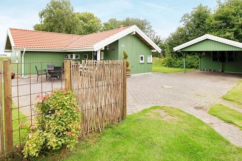 Well-appointed holiday cottage with whirlpool and sauna in the first row approx. 50 m from the water on a planted plot. The double bed in one bedroom is electric bed. The house is bright and comfortably furnished and in the kitchen you will find both...