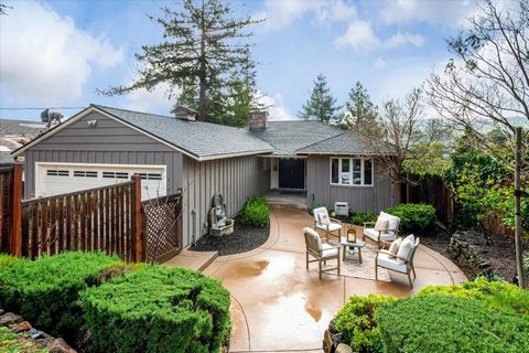 Price Reduced! This Mid-Century two-story home has every feature the future homeowner could ever want. The open living room has recessed lighting w/ stone hearthed wood burning fireplace surrounded by original oak hardwood flooring. Updated custom Ki...