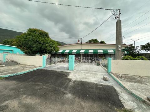 Four (4) bedroom, two (2) bathroom house with a well-kept, fruited yard (mango, ackee, soursop and banana). This house is a two (2) family or duplex. On either side is two (2) bedrooms, one (1) bathroom. There is a boat shed at the back of the yard (...