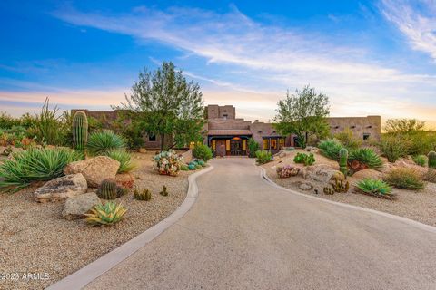 This custom home in Candlewood Estates is a true masterpiece, offering an unparalleled living experience on a private, north/south-facing lot along the 18th hole of the prestigious Troon North Pinnacle Golf Course. Enjoy the breathtaking views that e...