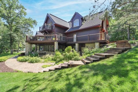 Discover the epitome of Northwoods luxury with this lakefront estate on Ossawinnamakee Lake. Spanning 5+ acres with 560ft of waterfrontage, experience endless fun with the hard-sand swimming area and meticulously landscaped grounds. Boasting 8 bedroo...