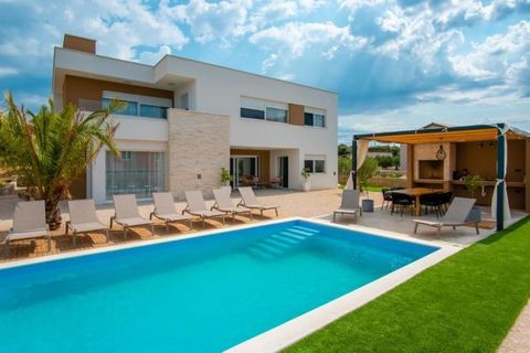 Luxury modern villa with swimming pool in Mandre on Pag! We are selling this beautiful detached villa of 270 sq.m. on a land plot of 1124m2 located in a quiet environment only 400 meters from the sea. The villa is divided into two floors where on the...