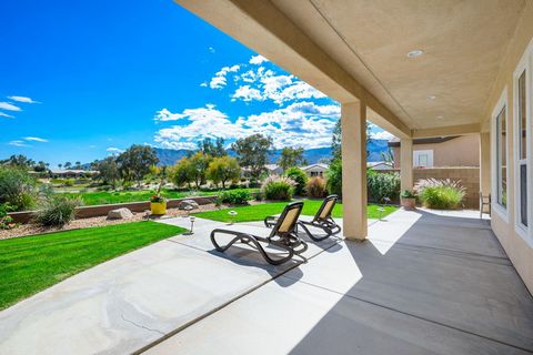 Nestled along the 11th fairway of the championship Trilogy Golf Club, this bright Monarch plan residence boasts stunning southern mountain and sweeping fairway vistas. Newly furnished and exuding a wow factor upon entry, its spacious, open layout flo...