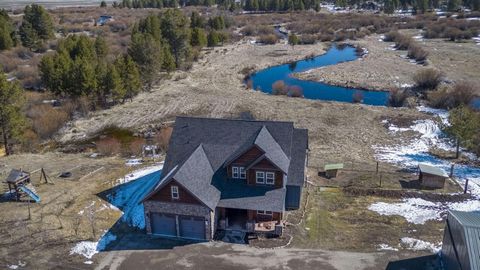 Riverfront stunner! Unobstructed private views of the Little Deschutes on roughly 4 acres. This northwest property is fenced and gated with cedar and galvanized posts, stunning rock siding with a 48x36 shop. The home boasts an open floor plan with a ...