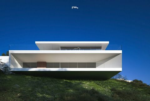 LUXURY NEW BUILD VILLA WITH THE SEA VIEWS IN MORAIRA New Build Luxury villa with sea views in Moraira. Villa articulates the interior spaces through simple, pure and emphatic geometries. It is accessed through a ramp and stairs integrated into the gr...