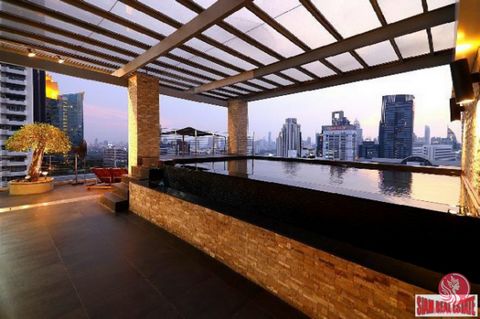 Penthouse Condo with private lifts and swimming pool on terrace balcony at Asoke. Located in a prime location between Sukhumvit Soi 19 and Soi 21 only 550 metres to BTS Asoke and MRT Sukhumvit. Also very short distance to Terminal 21 shopping mall, a...