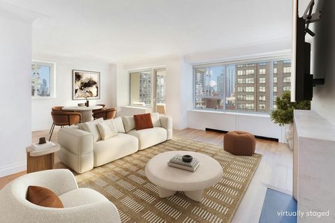 New to Market - The most coveted high-floor two-bedroom home in the B tower of Manhattan House, with a flexible third bedroom. The enormous 24' gallery leads to the great room with skyline views to the south. Ideal for entertaining, it includes a siz...