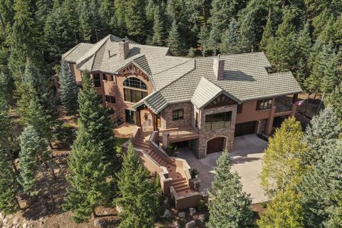 Broadmoor Resort Custom Home Located on 3+ Acres! The exquisite craftsmanship and attention to detail are evident throughout this beautiful custom home. The 4 bedroom + office/study, 5 bath home features 5-car oversized garage. The main level include...