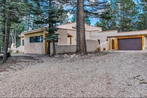 Nestled amidst the picturesque landscape of Angel Fire, New Mexico, this stunning mountain home offers an abundance of space with its five bedrooms and six bathrooms. The property showcases a harmonious blend of rustic charm and modern luxury, with t...