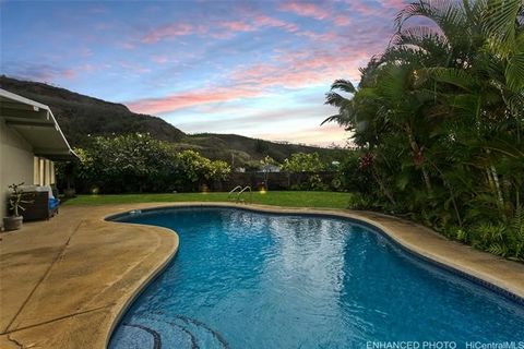 Nestled on a hillside in one of Oahus most sought-after locales, this beautifully renovated Kailua home offers a warm island charm set against the backdrop of gorgeous Koolau and Olomana mountain views. The property boasts a custom heated tiled pool ...