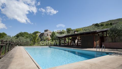 The property belongs to the Italian film director Michelangelo Antonioni and includes a main building that develops on a living area of approximately 470 sqm, divided over three levels: On the ground floor, there is a twin living room with a kitchen....