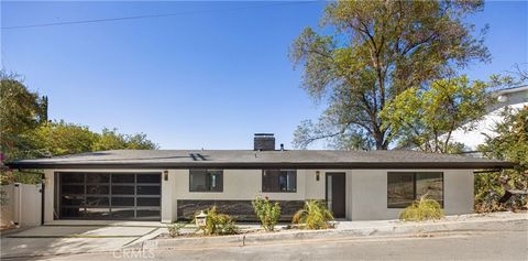 Discover modern luxury in this exquisite home in Sherman Oaks, where sweeping panoramic views stretch across the skyline. Fully renovated, this contemporary masterpiece showcases sleek architecture, expansive interiors, and stunning vistas from nearl...