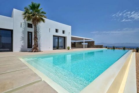 Perched on a private 6,000 m² plot, just 650 meters from Ambelas beach, this sumptuous villa embodies the minimalist elegance of the Cyclades, sublimated by contemporary design and top-of-the-range finishes. With 535 m² of living space, complemented ...