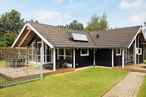Holiday cottage located on the northern part of Funen. The living room is combined with the kitchen and has access to the covered terrace. The house has a bothroom with whirlpool and sauna. The children will probably enjoy playing on the large natura...