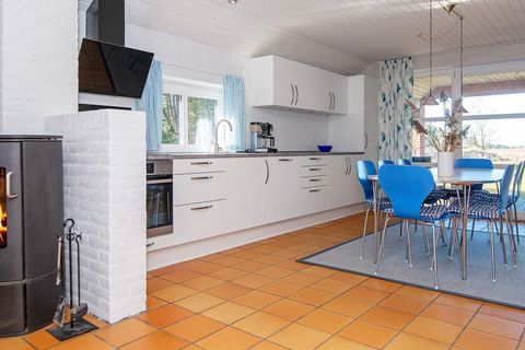 This holiday cottage with whirlpool and sauna is located on a large natural plot not far from the Wadden Sea in Kromose. Open concept kitchen and living room with large window sections and a wood-burning stove. The kitchen and living room has tile fl...