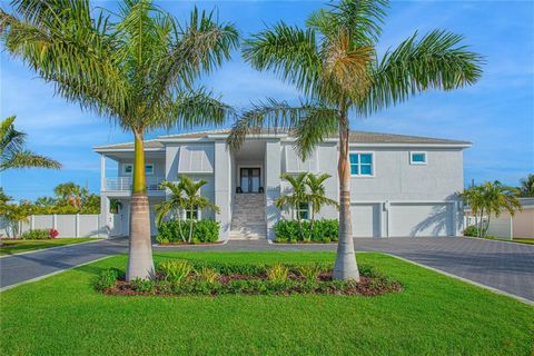 PRIVATE RESIDENTIAL ACCESS TO THE GULF OF MEXICO PLUS NEW POOL! Presenting an unparalleled residence, this four-bedroom, four-bathroom marvel stands proudly on an expansive 140 ft-wide double lot. Situated just a stone's throw away (a mere 30-second ...
