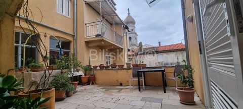 www.biliskov.com  ID: 14019 Krk, the old town center near the waterfront A spacious and furnished three-room apartment with a total area of 75.66 m2 is located on the first floor of an older stone building built around 1800. The apartment consists of...