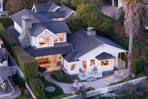 Enjoying one of the most dramatically beautiful views of the California coastline stretching the entire Monterey Bay from Santa Cruz to the Peninsula and the grand Pacific beyond, this stunning residence on Depot Hill in Capitola provides an incredib...