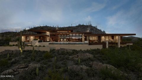 The Mustang residence is nestled on 4.7 acres with breathtaking 360-degree mountain views. Facing southwest, this residence perfectly captures the tranquil surroundings, offering a seamless blend of indoor-outdoor living on a single-level split floor...