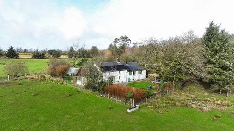 Set against the backdrop of the Cambrian mountain range, this charming three-bedroom Welsh cottage offers an unrivalled panorama, ensuring a picturesque and tranquil setting. Positioned on a hillside and encompassing approximately 0.5 acres of landsc...