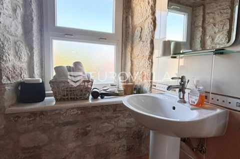 Trogir, a beautiful stone house located just 200 meters from the old town center. The house consists of a commercial space on the ground floor of approximately 32m2 and three apartments on each floor of 36m2 each. The property is ideal as an investme...