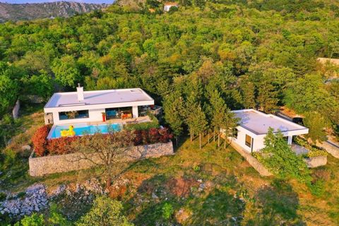 Villa  of 185 sq..in Kostrena with beautiful sea views and great land plot of 2200 sq.m. where we find two detached buildings. The main building is designed as a 2 bedroom + living room space with a total living area of 120m2 which consists of a kitc...