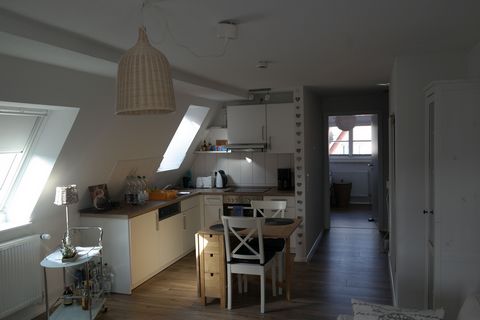 The apartment is located on the 2nd floor/attic storey of a listed building. It is fully and modernly equipped and furnished with a modern kitchen incl. dishwasher, stove with ceramic hob and crockery. The bedroom has two single beds and a large buil...