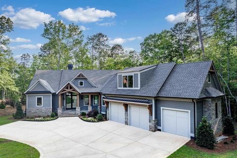 Indulge in the epitome of lakeside luxury with this exquisite 6-bedroom, 7-bathroom retreat nestled within Richland Pointe in Reynolds Lake Oconee. Boasting panoramic lake views and soaring high ceilings, this residence seamlessly combines opulence w...