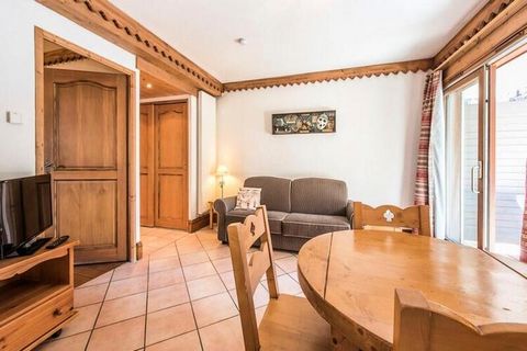 This charming 30 m² ground-floor apartment offers a cozy and modern retreat for up to four guests. The living area features a comfortable convertible sofa bed, a dining table with four chairs, and an open kitchen area equipped with all essentials. Th...