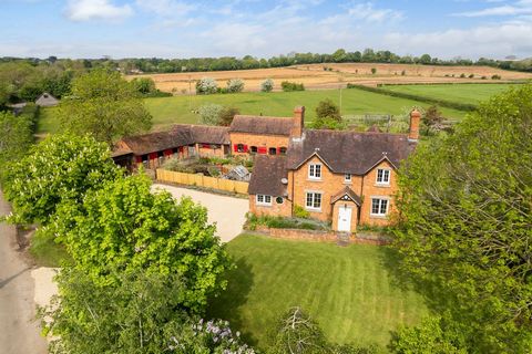 A former farmhouse, this equestrian country home lies within the picturesque village of Pirton. This comfortable four bedroom house, with two bedroom annex, boasts ample living spaces, traditional features, and is set within three and a half acres, a...