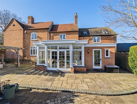 A distinctive former farmhouse having origins circa 1890. This substantial double fronted property retains the traditional arched blue brick definition over the windows on the façade and has a protective storm porch relevant to its original era. The ...