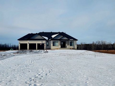 This stunning 2023 built bungalow boasts a timeless all-stone exterior on a sprawling 2-acre lot, offering privacy and tranquility. Inside, the open-concept chef's kitchen is a masterpiece, with custom tall cabinetry, a gas stove with pot filler, qua...