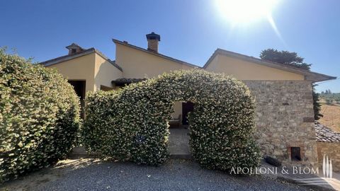 Renovated portion of country house with garden and loggia, in Cetona, Siena.