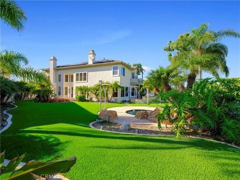 Presenting 6582 Radcliff Circle, an exceptional residence set upon an expansive 11,300 sf lot boasting approximately 130' of coveted golf course frontage within the exclusive confines of 'The Peninsula' guard gated community in Huntington Beach. This...