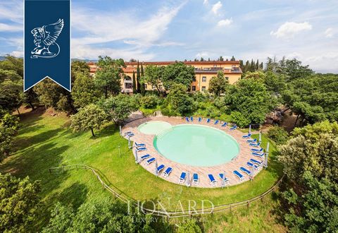 This charming hotel for sale is surrounded by the beautiful Tuscan hills, In Arezzo, in a quiet setting in a harmonious natural context. It enjoys 3.5 hectares of perfectly maintained private park which houses a splendid swimming pool with a sunbathi...