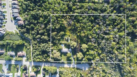 Rare chance to own 4.4 acres on the end of a court off of Innsifl Beach Road. The home is on a stunning 2-acre parcel, surrounded by mature weeping willow trees enveloping a tranquil running water pond an escape from the city life you've been looking...