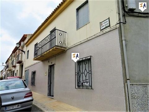 Located in the popular town of Alcaudete in the Jaen province of Andalucia. Larger than it looks this town house in a nice residential part of town has surprising outdoor space. Enter the front door into a living room, off to the left is another room...