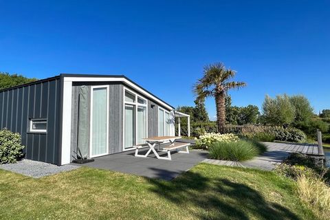 You'll find this holiday home near the entrance of this holiday park in Zeeland. The attractive furnishings and high-quality finish will make you feel immediately at home. The open living space has a fully equipped kitchen, cosy sitting area, TV and ...