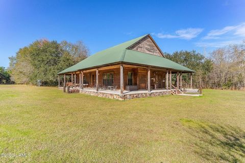 Home and 110 acres to be split from original tract.I'm thrilled to welcome you to Pondtown in the picturesque Hampton County, South Carolina. This incredible recreational property spans about 110 acres of pineland and hardwoods, just a stone's throw ...