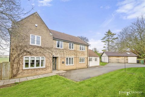 Set back behind an evergreen hedge and situated on a branch of Cumberland Gardens that leads to only four other houses, it is a very quiet spot. Originally constructed in the mid-seventies in yellow brick, partially clad in stone and softened by a Vi...